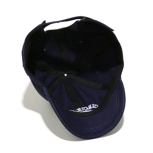 Inside view of navy cotton baseball cap featuring reinforced seams and white embroidery