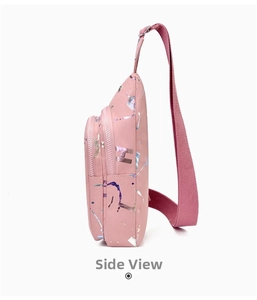 Side view of pink crossbody chest bag featuring colorful glossy ink splatter pattern