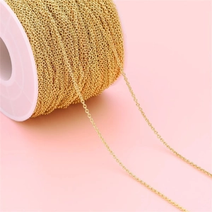 Detailed view of 18K gold plated stainless steel cable chain on a spool for DIY jewelry