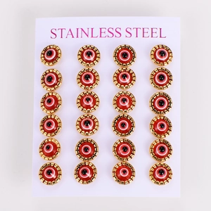 Macro view of 12 pairs of red evil eye earrings in gold-tone stainless steel settings