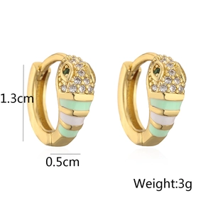 Detail shot of 18K gold snake earrings with dimensions 1.3cm by 0.5cm and 3g weight