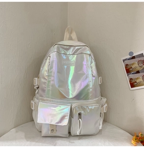 Detail view of laser PU backpack with holographic finish and side buckle straps