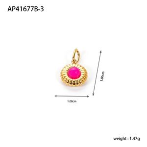 Detailed view of round gold pendant with rose red stone showing dimensions 1.86cm by 1.08cm