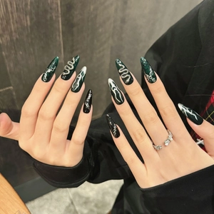 Dark punk stiletto press-on nails with silver snake relief and green color contrast