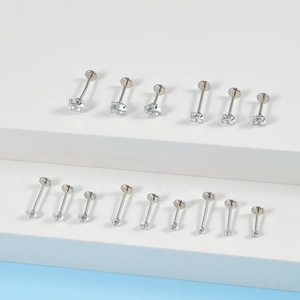 Various sizes of stainless steel labret studs with round clear cubic zirconia stones
