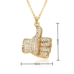 Detailed view of gold thumb-up pendant with white zircons showing 20mm x 18mm size