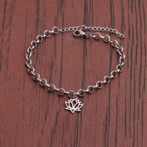 Minimalist stainless steel bracelet with a lotus flower charm on a classic link chain