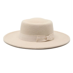 Elegant beige flat top wool boater hat with matching grosgrain ribbon and side bow detail