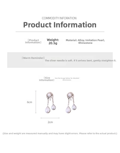 Detail view of silver earrings with waterdrop pearls and crystals weighing 20.5g