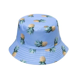 Detail of blue bucket hat with pineapple print showing reinforced stitching on the brim