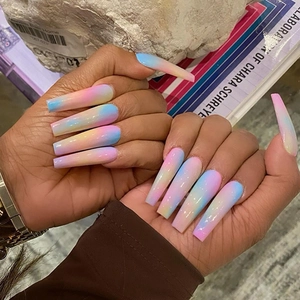 Long trapezoid press-on nails featuring a soft rainbow gradient with a glossy finish