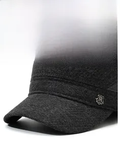Close-up of thick charcoal grey wool flat cap featuring a metallic R SPORT shield logo