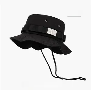Detail of waterproof sun hat featuring metal eyelets and OUTDOORS woven label