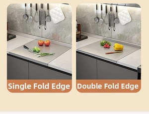 Detail of single and double fold stainless steel cutting board with brushed texture