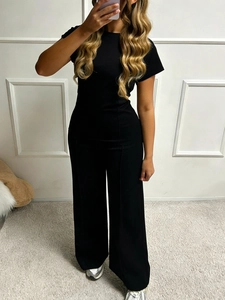 Women's two-piece casual set featuring a black short-sleeve top and wide-leg trousers