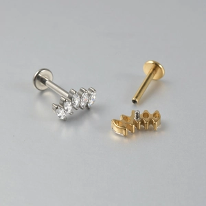 Close-up of F136 titanium labret studs with marquise zircon flower and internal thread