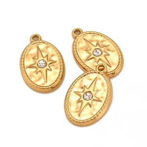 Detailed view of oval gold titanium steel star pendants with inlaid zircon stones