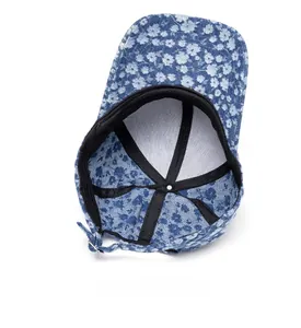 Internal view of floral denim baseball cap featuring sweatband and adjustable buckle