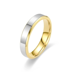 Detail of minimalist gold and silver titanium steel rings with polished beveled edges