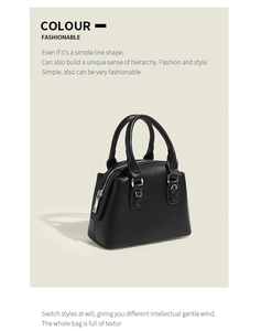 Détail d'un sac Boston noir chic avec texture en cuir et finitions métallisées
