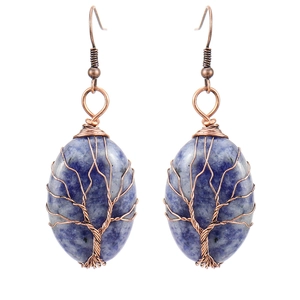 Detail of handmade wire-wrapped tree of life earrings with oval blue crystal stones
