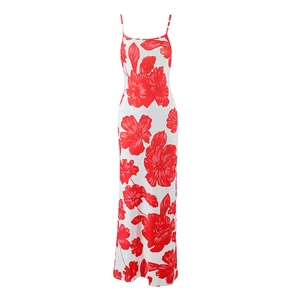 Detailed view of the sleeveless white floral maxi dress with red flowers and thin straps