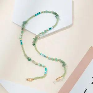 Detail of green stone and beaded glasses chain with gold lobster clasps and silicone loops