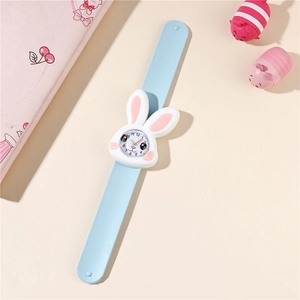 Detailed view of light blue rabbit slap watch for kids on a macaron theme background