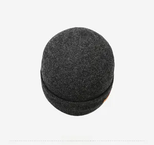 Top view of dark grey thick knit beanie showing warm fuzzy texture and round crown