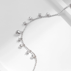 925 silver beaded bracelet with heart pendants and cubic zirconia on white background