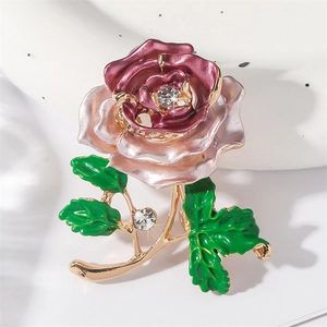 Elegant rose brooch with pink and deep red enamel petals and gold leaf accents