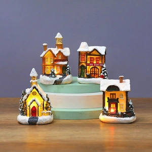 Set of 4 glowing Christmas village miniature houses with LED lights and snow coating