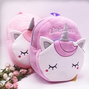 Plush unicorn backpacks for kids in pink and purple with soft 3D horn and ears details