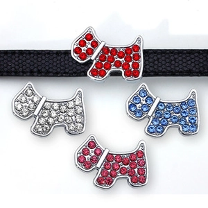 Detailed view of colorful rhinestone-studded dog sliders on a 8mm textured black strap