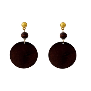Detailed view of geometric brown wood drop earrings with golden studs on white background
