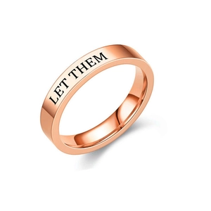 Detailed view of rose gold titanium steel ring with 'LET THEM' engraving