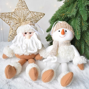 Plush Santa and snowman knitted ornaments set displayed in a snowy winter scene