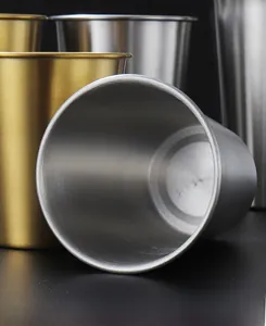 Macro detail of brushed 304 stainless steel texture and rounded rim on a metal beer cup