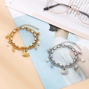 Bracelet double couche en acier inoxydable avec cœur et perles en finitions or et argent