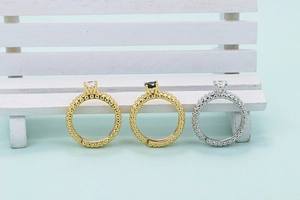 Three micro-paved cubic zirconia adjustable rings with beaded bands in gold and silver