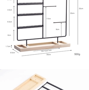 Detail view of black metal jewelry stand with wooden base and specific dimensions