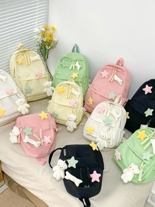 Minimalist canvas backpacks in multiple pastel colors with cute plush bear charms