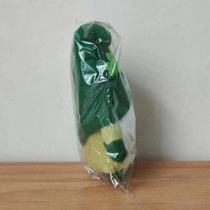 Detailed view of Saint Patrick's Day plush gnome gnome ornament in a protective plastic wrap