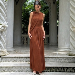Detailed view of the elegant brown sleeveless dress featuring chic ruched chest design