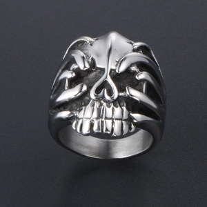 Vintage silver punk skull ring in stainless steel with detailed gothic bone carvings