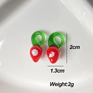 Handmade red glass strawberry earring pendants with dimensions 2cm height and 1.3cm width