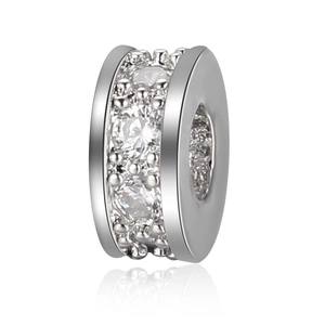 Macro shot of silver plated rondelle spacer bead with sparkling cubic zirconia inlay