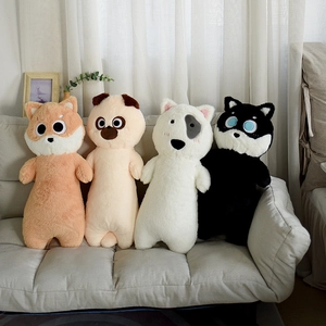 Cute long plush dog pillows featuring Shiba Inu and Husky designs on a gray sofa