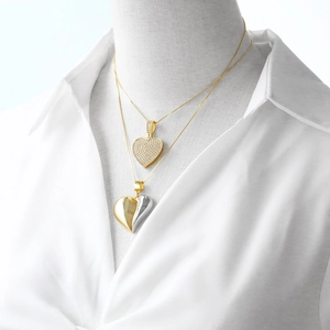 Gold plated heart pendant necklace with zircons and bicolor heart pendant on model