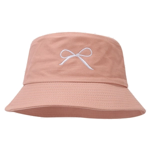 Pink cotton canvas bucket hat with white bow embroidery in a minimalist Korean style